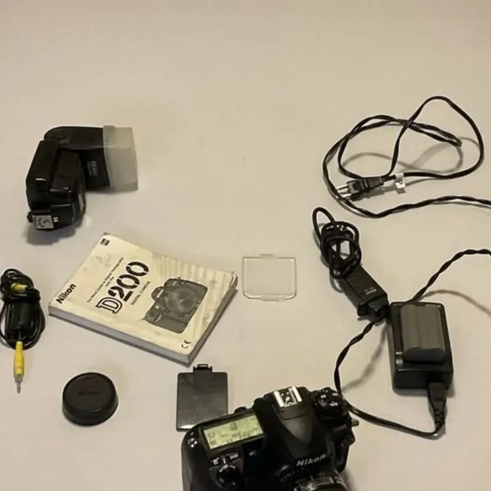 Nikon DS200 24 Mm Lens Plus Trigger 2 Batteries And Accessories